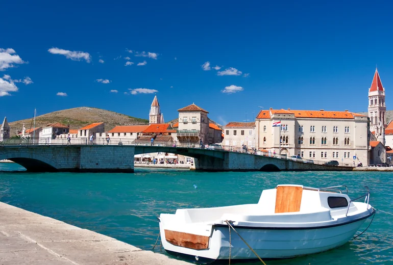 Catamaran cruising along Croatian coastline