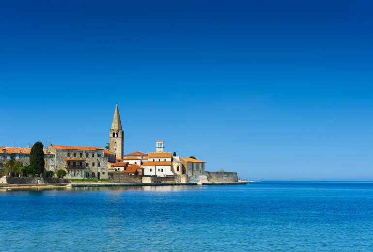 Croatian Adriatic harbour with small fishing boats and stone village
