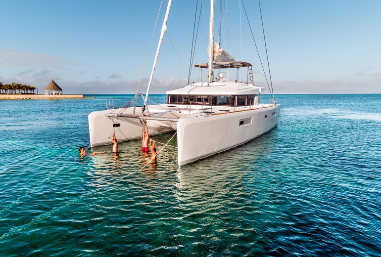 Charter catamaran anchored in a sheltered Croatian cove