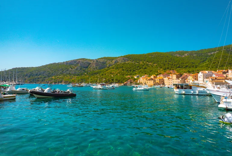 Komiža harbour with traditional fishing boats and colourful houses